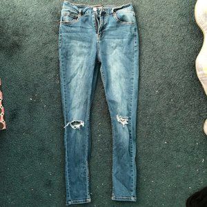 Blue skinny jeans with knee rips size 27